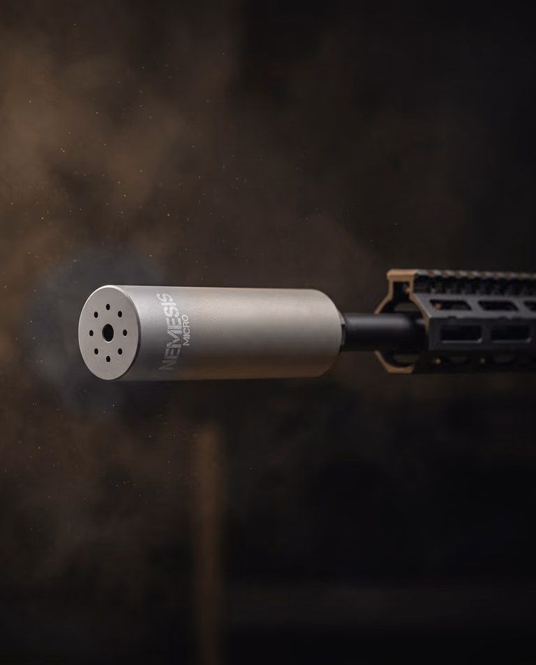 Саундмодератор NEMESIS MICRO 9mm з нержавіючої сталі встановлений на зброї - вид збоку